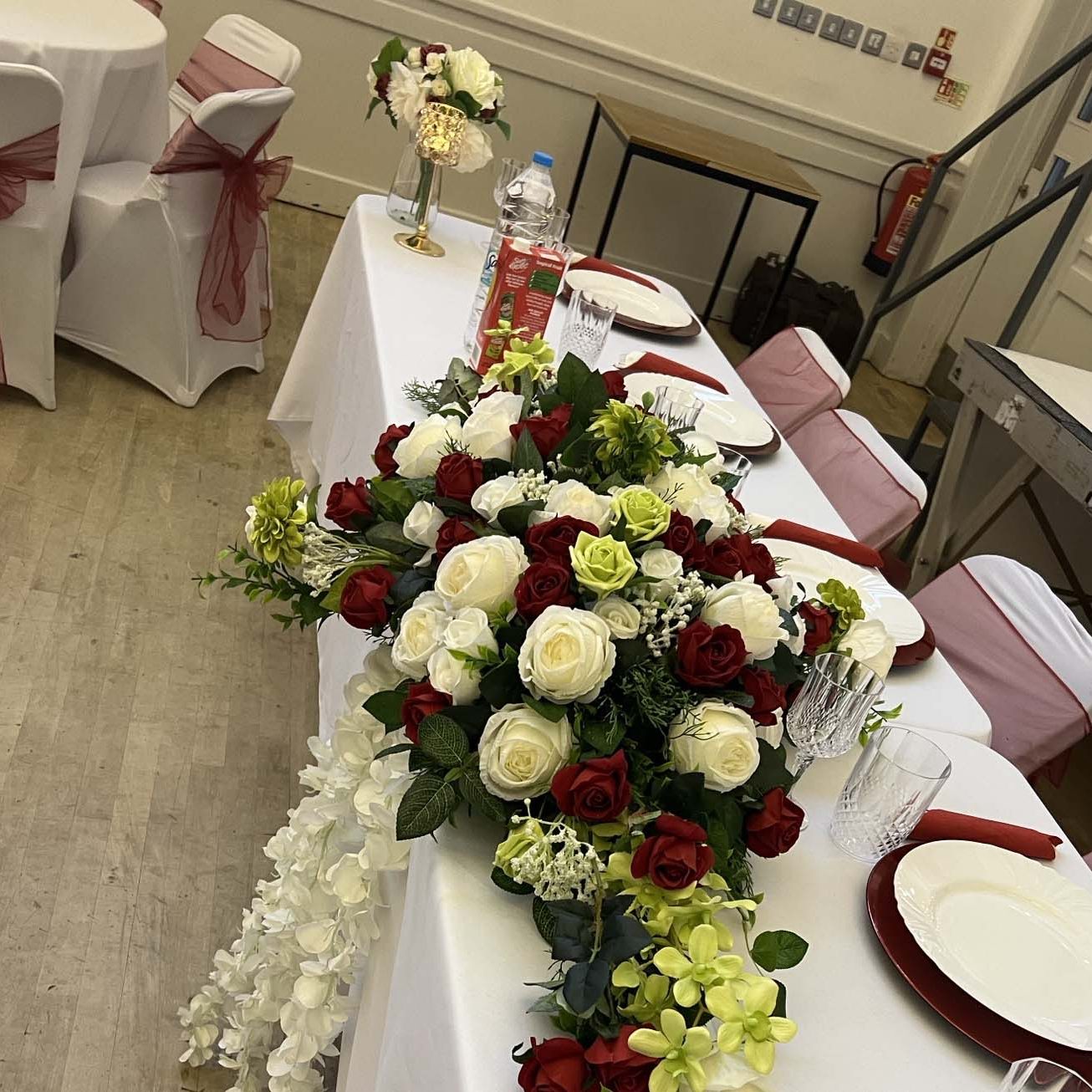 Top table flowers at wedding