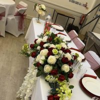 Top table flowers at wedding